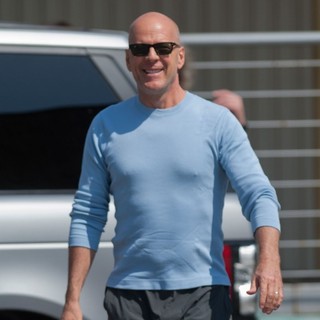 Bruce Willis in Bruce Willis Waves to Fans at Budapest Airport as He Arrives in The Hungarian Capital