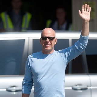 Bruce Willis in Bruce Willis Waves to Fans at Budapest Airport as He Arrives in The Hungarian Capital