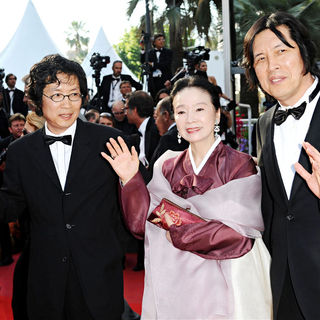 Lee David, Yoon Jung Hee, Lee Chang-dong in 2010 Cannes International Film Festival - Day 12 - Palme d'Or Closing Ceremony Red Carpet Arrivals