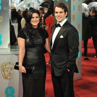 Gina Carano, Henry Cavill in The 2013 EE British Academy Film Awards - Arrivals