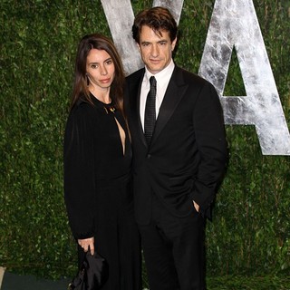 Tharita Catulle, Dermot Mulroney in 2012 Vanity Fair Oscar Party - Arrivals