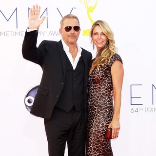 Kevin Costner, Christine Baumgartner in 64th Annual Primetime Emmy Awards - Arrivals
