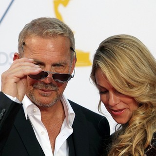 Kevin Costner, Christine Baumgartner in 64th Annual Primetime Emmy Awards - Arrivals