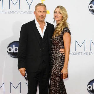 Kevin Costner, Christine Baumgartner in 64th Annual Primetime Emmy Awards - Arrivals