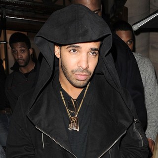 Drake in Drake Leaving Aura Nightclub