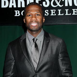 50 Cent in 50 Cent Signs Copies of His New Book Playground