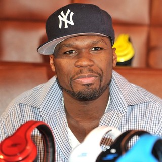 50 Cent in 50 Cent Signs Copies of his SMS Audio Designed Headphones