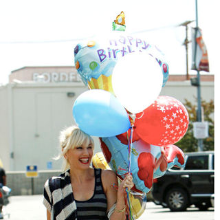 Gwen Stefani in Gwen Stefani Shopping at Party City in Hollywood with Family Holding A Bunch of Birthday Balloons