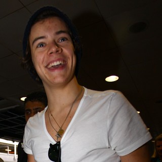 Harry Styles, One Direction in One Direction Arrive at Heathrow Airport