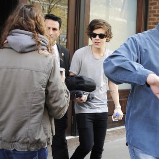 Harry Styles, One Direction in Harry Styles Carrying A Toiletry Bag, Is Seen Leaving The Hotel That He and Taylor Swift Arrived