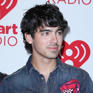 Joe Jonas, Jonas Brothers in 2012 iHeartRadio Music Festival - Day 2 - Arrivals