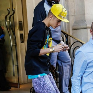 Justin Bieber in Justin Bieber Departs His Hotel Wearing A Yellow Studded Baseball Hat