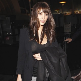 Kim Kardashian in Kim Kardashian Arrives at LAX Airport with A New Haircut featuring Bangs