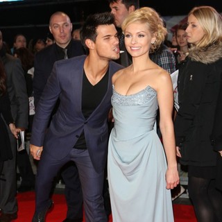 Taylor Lautner, MyAnna Buring in The Premiere of The Twilight Saga's Breaking Dawn Part II - Arrivals