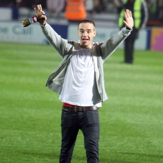 Liam Payne, One Direction in Liam Payne Supports Louis Tomlinson as He Takes Part in A Charity Football Match