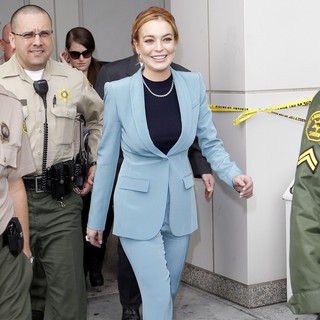 Lindsay Lohan in Lindsay Lohan Appears in Good Spirits as She Leaves LAX Courthouse with An Escort
