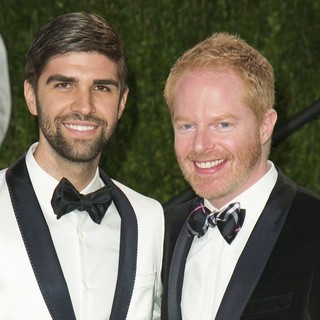 Justin Mikita, Jesse Tyler Ferguson in 2013 Vanity Fair Oscar Party - Arrivals