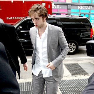 Robert Pattinson in Robert Pattinson is surrounded by photographers while leaving ABC studios