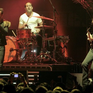 Brandon Flowers, Ronnie Vannucci, Jr., Mark Stoermer, The Killers in The Killers Performing at The American Airlines Arena