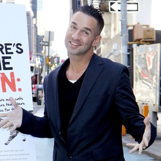 The Situation in The Situation Attends A Photocall in Times Square for PETA's Ad Campaign