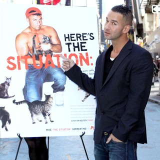 The Situation in The Situation Attends A Photocall in Times Square for PETA's Ad Campaign