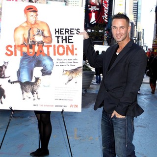 The Situation in The Situation Attends A Photocall in Times Square for PETA's Ad Campaign