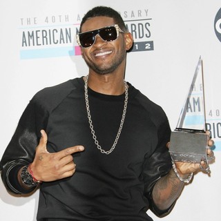 Usher in The 40th Anniversary American Music Awards - Press Room - usher-40th-anniversary-american-music-awards-press-room-01
