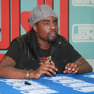 Wale in Wale Signs Copies of His Album Ambition
