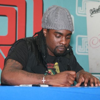 Wale in Wale Signs Copies of His Album Ambition