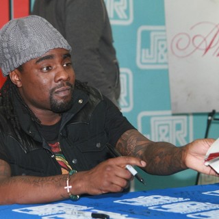 Wale in Wale Signs Copies of His Album Ambition
