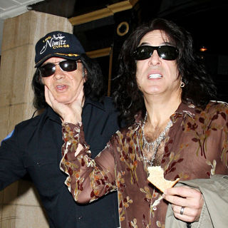 Gene Simmons, Paul Stanley in Gene Simmons and Paul Stanley Check Out of The Dorchester Hotel Holding A Piece of Toast