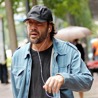 Javier Bardem at Javier Bardem listens to music as he takes a walk in a rainy Madrid