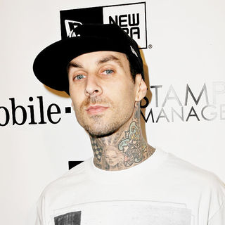 Travis Barker in the famous stars & straps 10th anniversary and Snoop Dog's 10th Studio Album celebrations