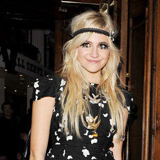 Pixie Lott leaving The Hard Rock Cafe holding a pair of drumsticks, having performed there