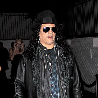 Slash arriving at pre-Oscars party at Chateau Marmont