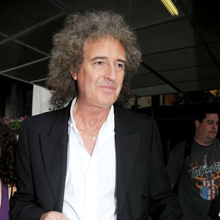 Brian May in Brian May Leaving The Ritz-Carlton Hotel to Attend A Signing of His Book 'A Village Lost And Found'