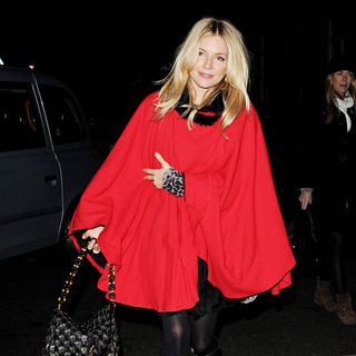 Sienna Miller in Sienna Miller Wearing A Large Red Cape at St. Paul's Church