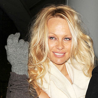 Pamela Anderson in Pamela Anderson Arriving at Heathrow Airport
