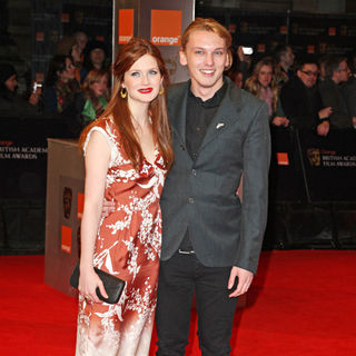 Bonnie Wright, Jamie Campbell Bower in 2011 Orange British Academy Film Awards (BAFTAs) - Arrivals