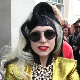 Lady GaGa in Lady GaGa Appears Outside her London Hotel to Give Out Cookies and Flowers to Her Fans