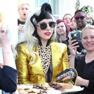 Lady GaGa in Lady GaGa Appears Outside her London Hotel to Give Out Cookies and Flowers to Her Fans