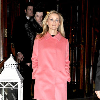 Reese Witherspoon in Reese Witherspoon departs her hotel wearing a bright pink coat