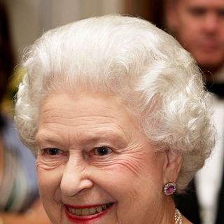 Queen Elizabeth II in Queen Elizabeth II Smiles During A Reception at Mansion House