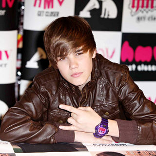 Justin Bieber in Justin Bieber signs his new album ' My World'