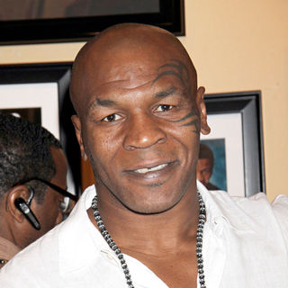 Mike Tyson in Mike Tyson Signs Autograph