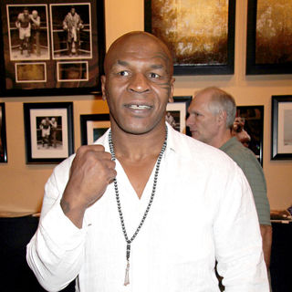 Mike Tyson in Mike Tyson Signs Autograph