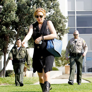 Lindsay Lohan in Lindsay Lohan Carrying A Large Blue and Gold Bag Outside The Santa Monica Courthouse