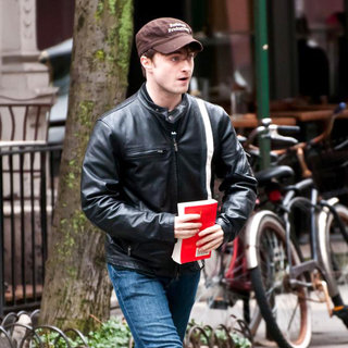 Daniel Radcliffe in Daniel Radcliffe Carrying a Book While Walking in The West Village