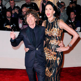 Mick Jagger, L'Wren Scott in Alexander McQueen: Savage Beauty Costume Institute Gala