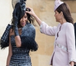 Struggling to Keep Hat in Place